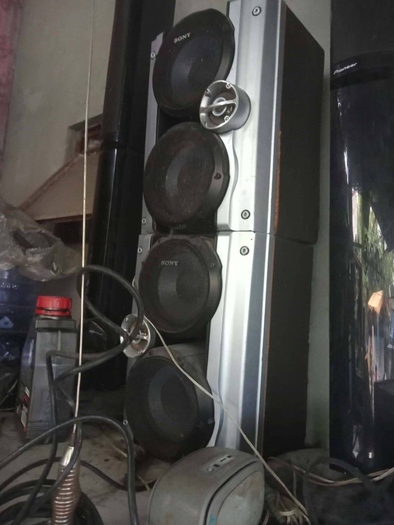 Sony tower speakers (Category: Soundbars, Speakers & Amplifiers) located in Manila. Submitted by wisegem-231b (Listing ID 1470451002, Image 1). Description: - Brand: Sony - Type: Heavy-duty tower speaker system - Color/Finish: Silver and black with exposed cones and built-in tweeters - Condition: Tested and working fine (dusty from storage) - Inclusions: Wires included - Features: Great sound output, perfect for home audio setups.