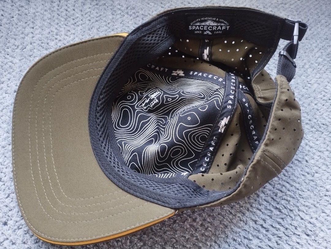 Spacecraft Collective Olive Green Perforated Cap (Category: Caps & Hats) located in Manila. Submitted by happycaps (Listing ID 1470409018, Image 2). Description: - Brand: Spacecraft Collective - Color: Olive Green - Breathability: Perforated body for airflow - Design: Structured front panel with mountain and vehicle graphic patch - Details: Cool topographic contour map print on the black inner sweatband - Fit: Adjustable with a secure plastic buc