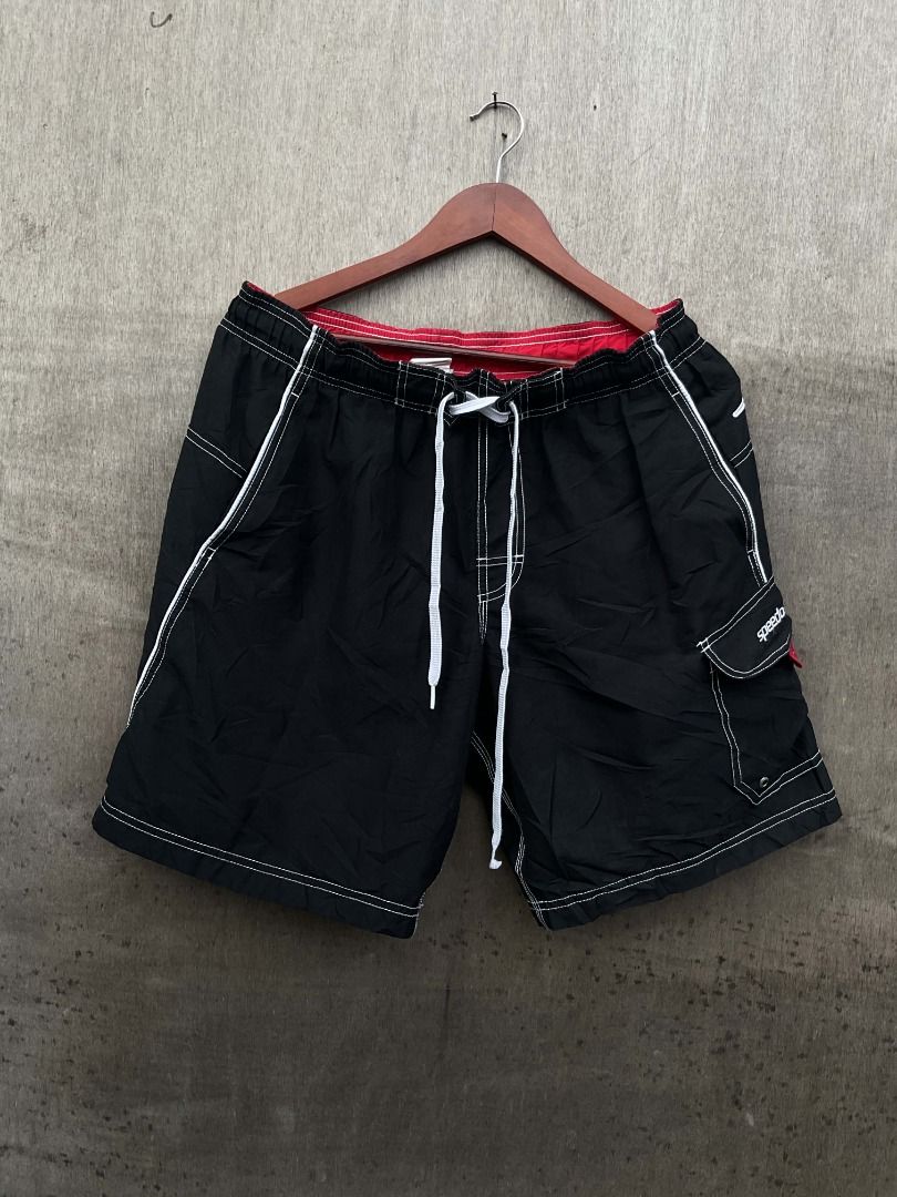 Speedo Black Cargo Board Shorts with White Drawstring (Category: Swim Trunks & Board Shorts) located in Talisay. Submitted by justindanielle17 (Listing ID 1470492021, Image 2). Description: -Authentic -Waist: 30 - 34 -Length: 19 inches -Leg opening : 12 inches -Like new condition -9.8/10 Color rate -No Flaws -Brand: Speedo - Color: Classic black with white contrast stitching - Fit: Adjustable drawstring waist - Features: Side cargo pocket with Sp