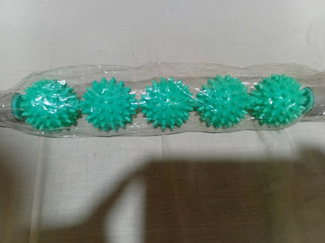 Spiky massage roller stick green handheld muscle roller (Category: Massage Devices) located in Manila. Submitted by seesalt (Listing ID 1470514400, Image 1). Description: for sale.massage rollong pin - Item: Brand New Green Handheld Muscle Roller Stick - Condition: Still sealed inside original clear plastic packaging - Design: Plastic rod featuring 5 spiky spinning balls - Benefits: Effectively relieves muscle tension, knots, and soreness - Usage