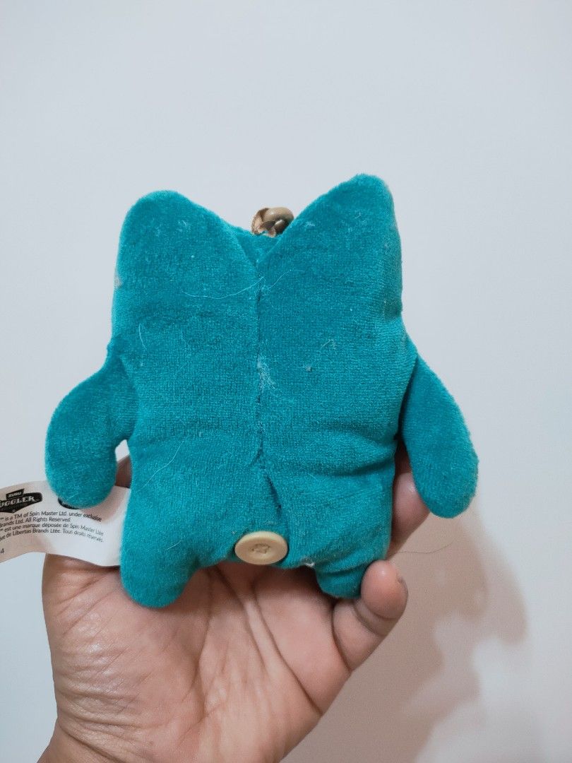 Spin Master Zuru Fuggler Greedy Grinner Plush Charm (Category: Plushies & Soft Toys) located in Antipolo. Submitted by bhabiegraciefashionlab (Listing ID 1470427810, Image 3). Description: Character: Greedy Grinner (teal/blue body with a green eye area, a wide grinning mouth, and human-like teeth). Type: 5-inch / 11–13 cm plush clip-on keyring/pendant. 🇯🇵Authentic From Japan 🔖Good as New 📸Actual Photos posted, what you see is what you'll get 