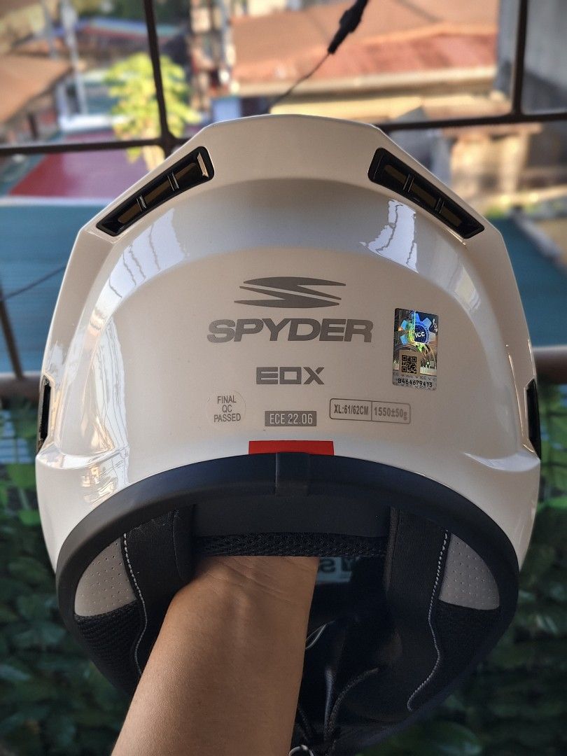 Spyder EOX Full Face Helmet White Size XL (Category: Bicycles) located in Manila. Submitted by kuys_vince. (Listing ID 1470554882, Image 2). Description: Spyder EOX full face motorcycle helmet. Gloss white finish with grey and red graphics. Size XL, fits 61 to 62 centimeters. ECE 22.06 safety certified. Pinlock 70 ready visor with protective sticker still attached. Quick release retention system, multi-density EPS liner, and ABS composite shell. 