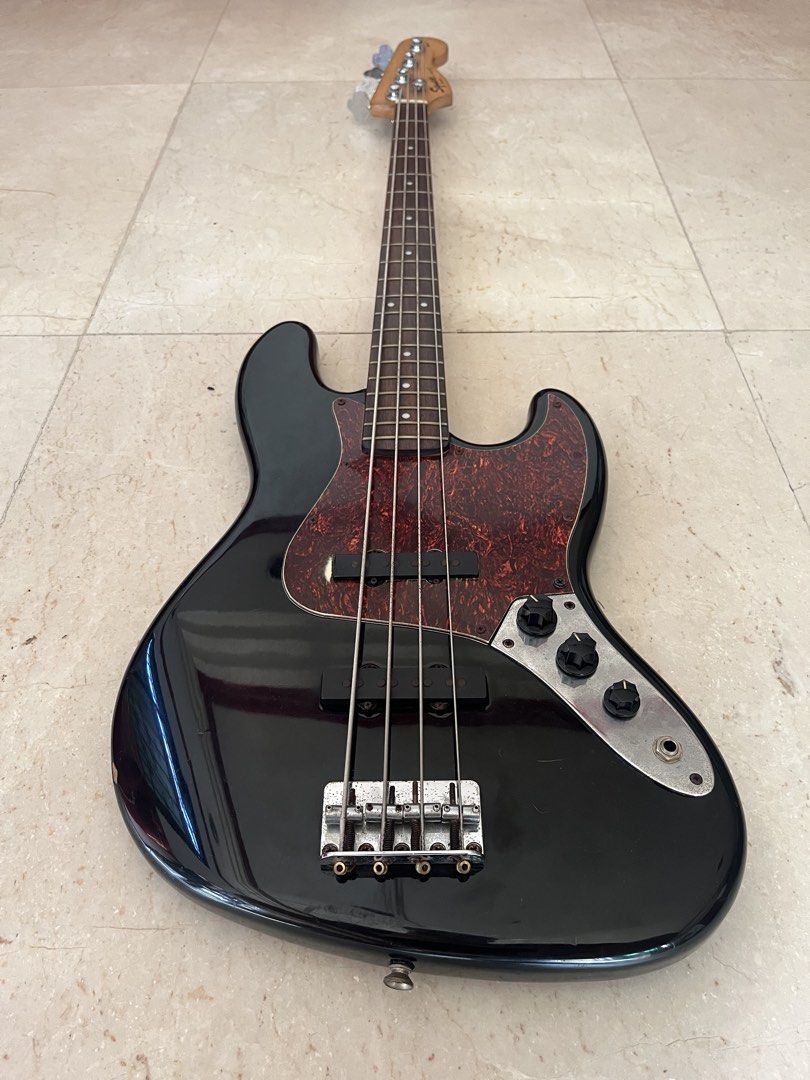 SQUIER JAZZ BASS GUITAR (Category: Musical Instruments) located in Caloocan City. Submitted by wawakodu-61530 (Listing ID 1470466642, Image 2). Description: FOR SALE/FOR TRADE Squier Jazz Bass (Affinity) Crafted in Indonesia All stock parts Comes with free extra strings (Ernieball roundwound) Issue: old strings and paint chip only SELLING PRICE: 9,499 pesos TRADE VALUE: 12,000 pesos Negotiable for sure buyer.
