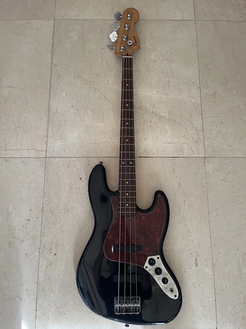 SQUIER JAZZ BASS GUITAR (Category: Musical Instruments) located in Caloocan City. Submitted by wawakodu-61530 (Listing ID 1470466642, Image 1). Description: FOR SALE/FOR TRADE Squier Jazz Bass (Affinity) Crafted in Indonesia All stock parts Comes with free extra strings (Ernieball roundwound) Issue: old strings and paint chip only SELLING PRICE: 9,499 pesos TRADE VALUE: 12,000 pesos Negotiable for sure buyer.