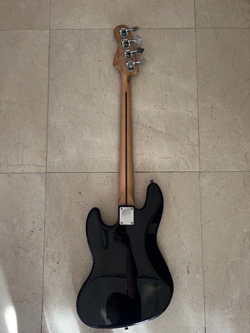 SQUIER JAZZ BASS GUITAR (Category: Musical Instruments) located in Caloocan City. Submitted by wawakodu-61530 (Listing ID 1470466642, Image 3). Description: FOR SALE/FOR TRADE Squier Jazz Bass (Affinity) Crafted in Indonesia All stock parts Comes with free extra strings (Ernieball roundwound) Issue: old strings and paint chip only SELLING PRICE: 9,499 pesos TRADE VALUE: 12,000 pesos Negotiable for sure buyer.