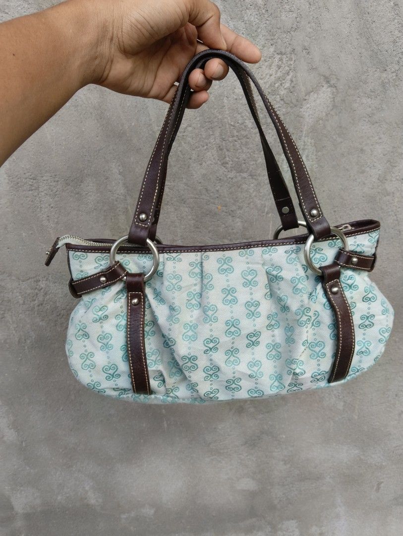 SSAMZIE Light Blue Monogram (Category: Shoulder Bags) located in Cagayan de Oro. Submitted by warmbird-f84aab (Listing ID 1470552254, Image 1). Description: Cute & practical vintage-style handbag from Korean brand SSAMZIE! Light blue fabric with signature monogram pattern + smooth brown faux leather trims. Spacious interior with multiple pockets, zip closure, and silver hardware. Lightly used with normal signs of wear — still in great condition! 