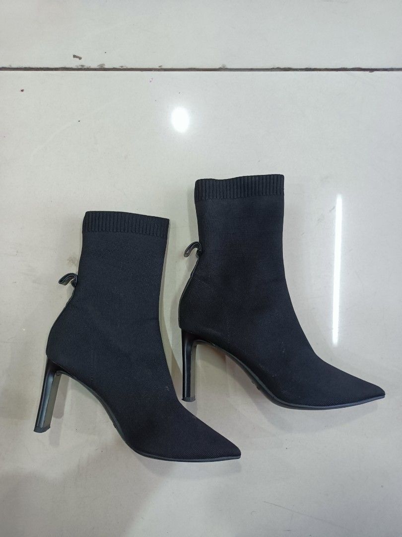 Staccato Black Stiletto Sock Boots Size 230 (Category: Boots) located in Manila. Submitted by pnjdianne25879 (Listing ID 1470455431, Image 3). Description: euro 38 - Brand/Model: Staccato Black Sock Boots - Size: 230 (PH/KR sizing) - Design: Pointed toe with a sleek stiletto heel - Material: Stretch knit fabric that comfortably hugs the ankle - Detail: Cute small loop at the back heel for easy wear - Condition: Clean overall with light scuffs on 
