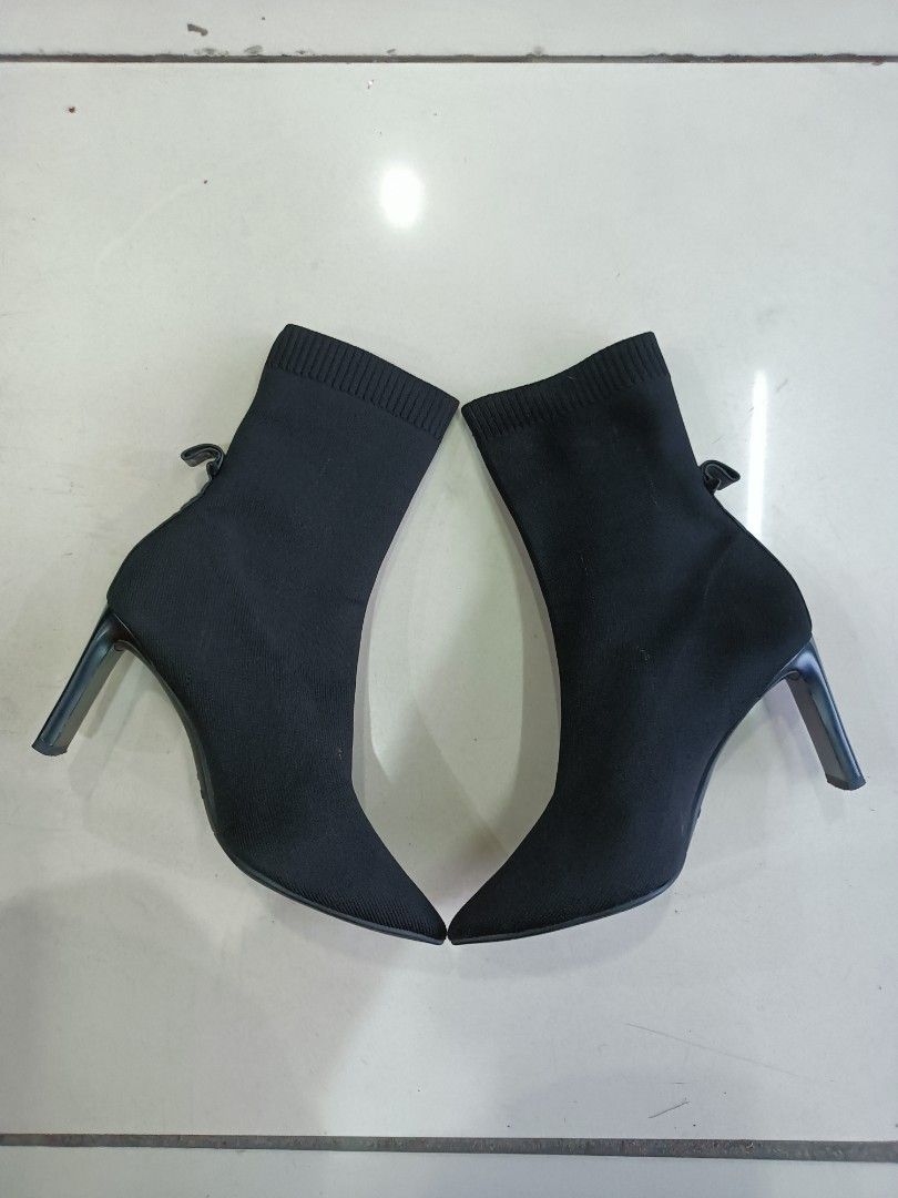 Staccato Black Stiletto Sock Boots Size 230 (Category: Boots) located in Manila. Submitted by pnjdianne25879 (Listing ID 1470455431, Image 1). Description: euro 38 - Brand/Model: Staccato Black Sock Boots - Size: 230 (PH/KR sizing) - Design: Pointed toe with a sleek stiletto heel - Material: Stretch knit fabric that comfortably hugs the ankle - Detail: Cute small loop at the back heel for easy wear - Condition: Clean overall with light scuffs on 