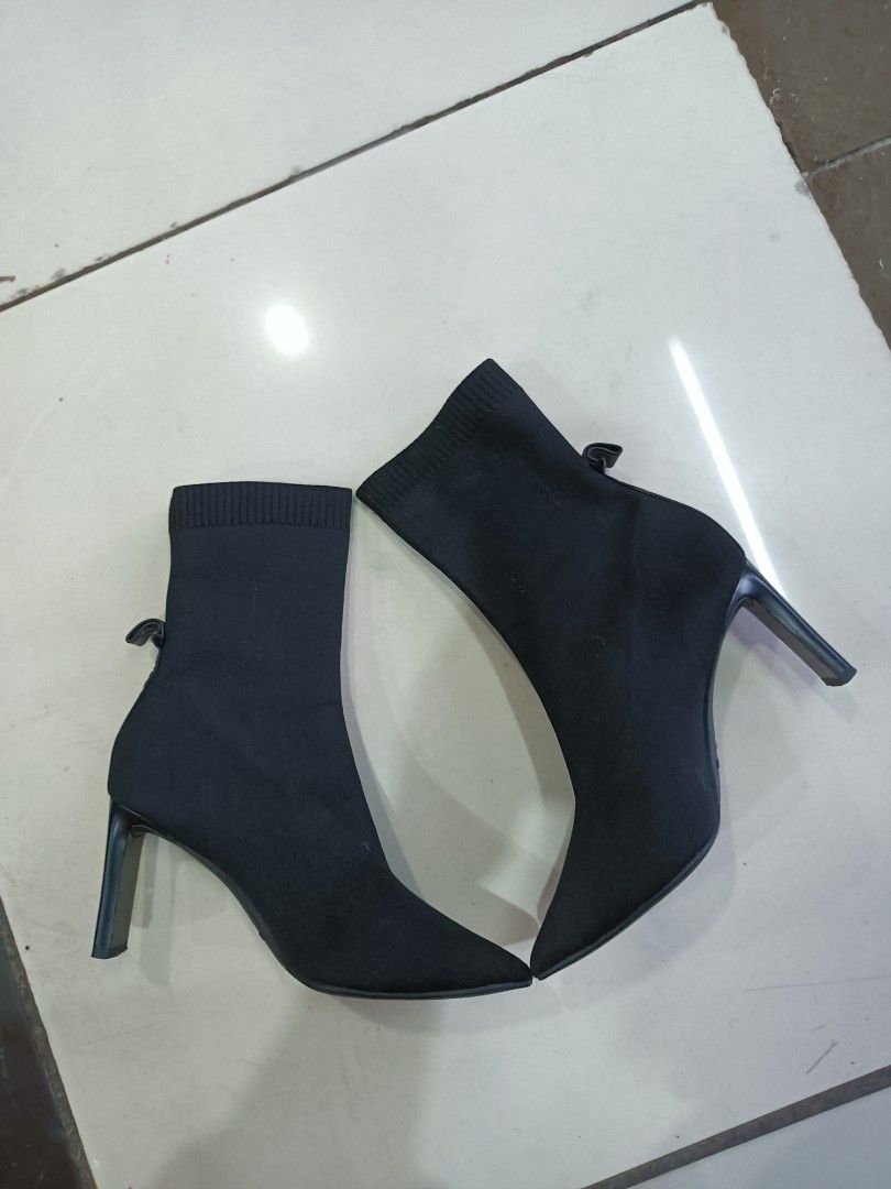 Staccato Black Stiletto Sock Boots Size 230 (Category: Boots) located in Manila. Submitted by pnjdianne25879 (Listing ID 1470455431, Image 2). Description: euro 38 - Brand/Model: Staccato Black Sock Boots - Size: 230 (PH/KR sizing) - Design: Pointed toe with a sleek stiletto heel - Material: Stretch knit fabric that comfortably hugs the ankle - Detail: Cute small loop at the back heel for easy wear - Condition: Clean overall with light scuffs on 