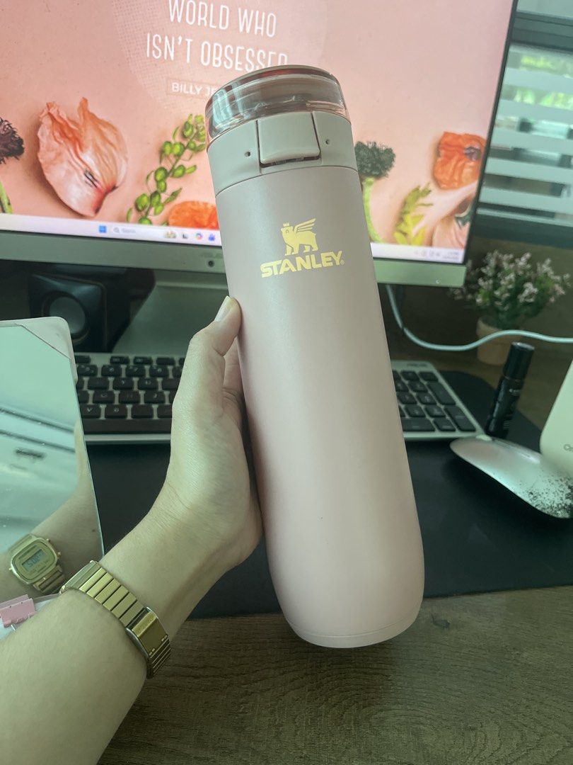 Stanley Pink Insulated Water Bottle (Category: Water Bottles & Tumblers) located in Aloran. Submitted by kaishamarie25 (Listing ID 1470400782, Image 1). Description: - Authentic Pink Stanley Water Bottle - Elegant gold logo printed on the front - Clear and pink lid mechanism with a convenient push-button flip top - Double-wall insulation keeps drinks hot or cold for hours - Slim design fits easily in most bags and car cup holders - Ideal for work