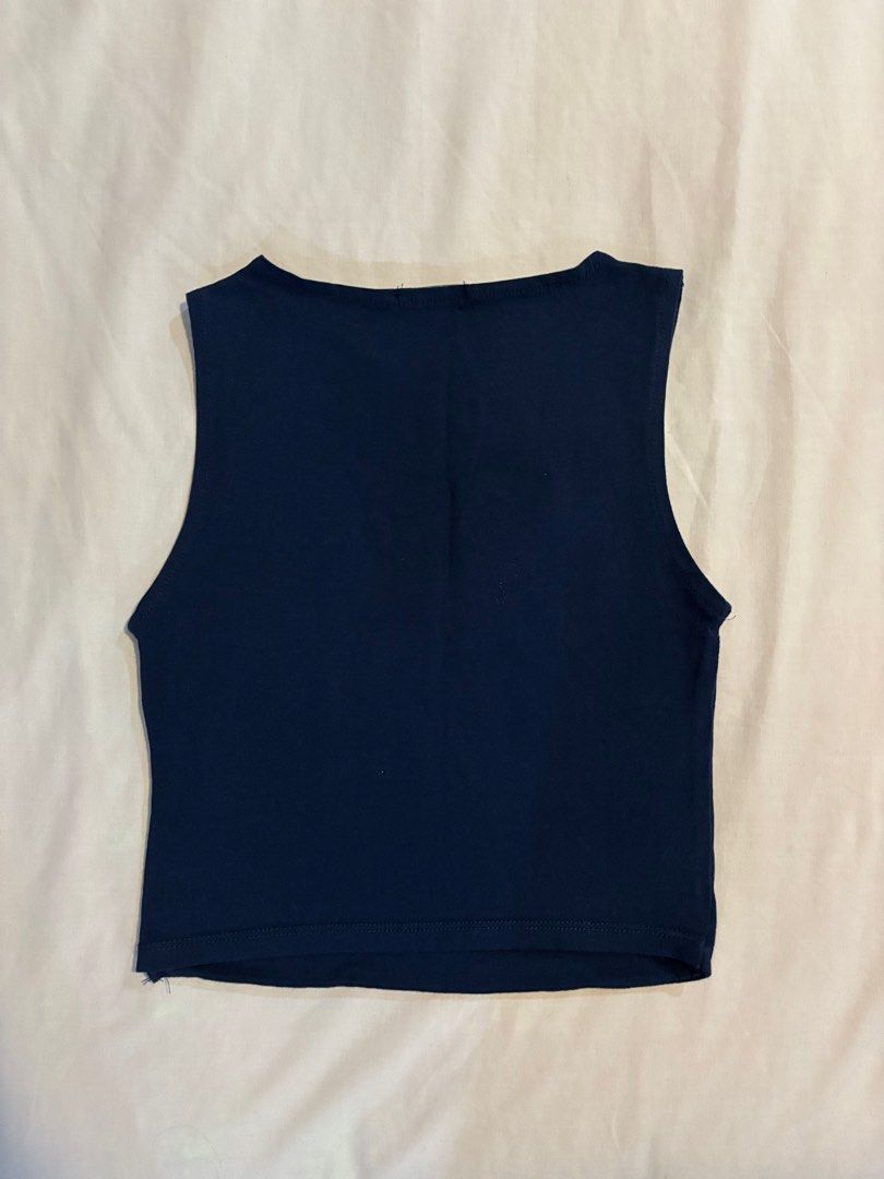 Stradivarius Dark Blue Sleeveless Top (Category: Sleeveless) located in Quezon City. Submitted by cmtom (Listing ID 1470368940, Image 2). Description: Loc: qc Dark blue boatneck tank top from Stradivarius, bought in 2022/2023. Fabric is stretchy and comfortable Best fits size XS-S and people with narrower shoulders (the armpit part folds awkwardly on me as i have broader shoulders) Has some detergent stains (which are removable with handwashing) 
