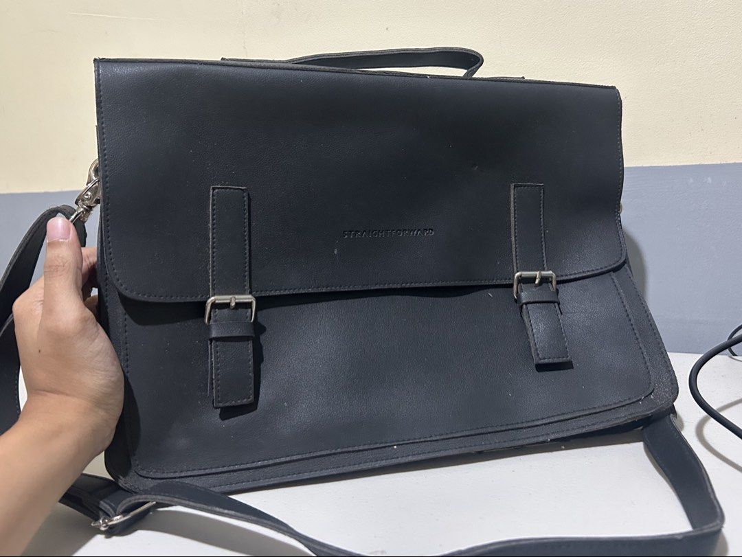 Straightforward Black Messenger Bag Briefcase (Category: Sling Bags) located in Caloocan City. Submitted by g4bbygabby (Listing ID 1470488623, Image 1). Description: RFS decluttering. No damage. Need lang linisin - Brand: Straightforward - Color: Matte Black - Style: Structured messenger bag with top handle & adjustable shoulder strap - Closure: Flap with dual vertical strap & metal buckle accents - Details: Embossed brand lettering on front flap