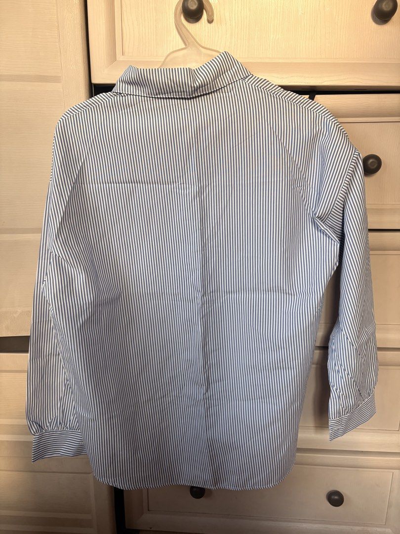Striped Longsleeve Polo (Category: Longsleeves) located in Makati City. Submitted by iu__00 (Listing ID 1470443940, Image 2). Description: - Classic blue and white striped design - Freesize - Collared neckline with front button closure - Long sleeves with button cuffs - Relaxed, comfortable fit - Lightweight fabric, great for work or casual wear.