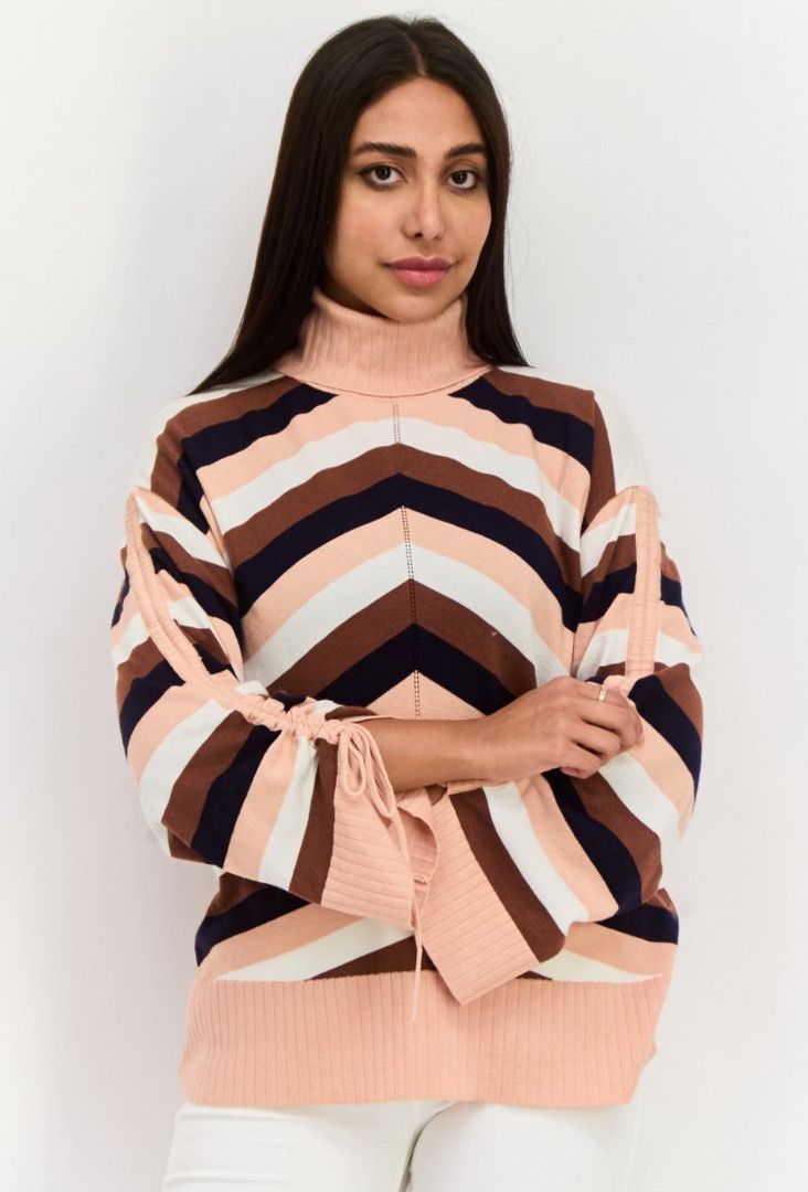 Striped Turtleneck Sweater Chevron Pattern Ribbed Cuffs (Category: Longsleeves) located in Baliuag. Submitted by crateandbarrel (Listing ID 1470541348, Image 3). Description: With tag - Colorblock striped chevron pattern in peach, white, brown, and navy - Features trendy adjustable drawstring ties along the long sleeves - Cozy ribbed high neck, hem, and cuffs - Oversized, relaxed fit (best fits sizes XS to Medium) - Super comfy and stylish for ev
