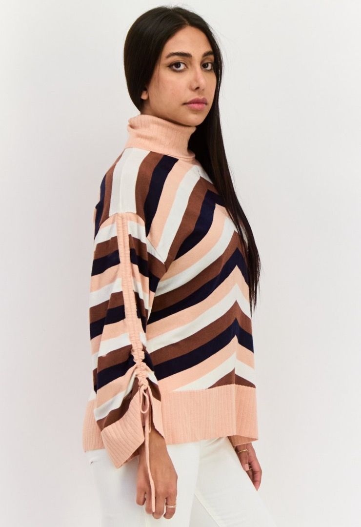 Striped Turtleneck Sweater Chevron Pattern Ribbed Cuffs (Category: Longsleeves) located in Baliuag. Submitted by crateandbarrel (Listing ID 1470541348, Image 2). Description: With tag - Colorblock striped chevron pattern in peach, white, brown, and navy - Features trendy adjustable drawstring ties along the long sleeves - Cozy ribbed high neck, hem, and cuffs - Oversized, relaxed fit (best fits sizes XS to Medium) - Super comfy and stylish for ev