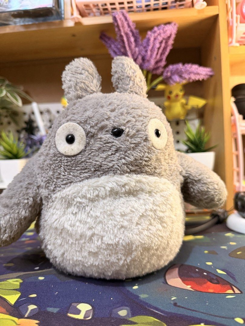 Studio Ghibli Totoro Plush Stuffed Toy Grey (Category: Plushies & Soft Toys) located in Baguio. Submitted by jonathanseller_buyer (Listing ID 1470514313, Image 1). Description: - Authentic Studio Ghibli Grey Totoro plushie - Super soft, fuzzy material with a cute white belly and round ears - Features a chunky tail on the back and small side tag - Pristine condition: clean fur, no stains, rips, or damage - Perfect addition to any Ghibli collection
