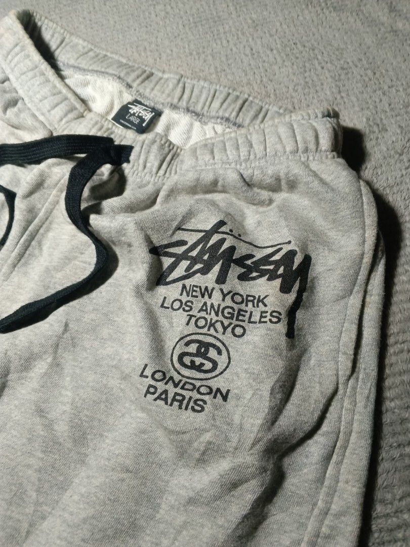 Stussy shorts (Category: Shorts) located in Cebu City. Submitted by authenticgrids (Listing ID 1470457449, Image 2). Description: Stüssy World Tour Sweat Shorts 🌎 Excllent Condition ✨ Issue/s: None Size on Tag L 🏷️ Best Fit: Medium Dimensions Width 14-16 stretchable inches Waistline actual measurements 28 can fit up to 32 📏 Length 17 inches 📥📥📥📥📥 DM us for more details.