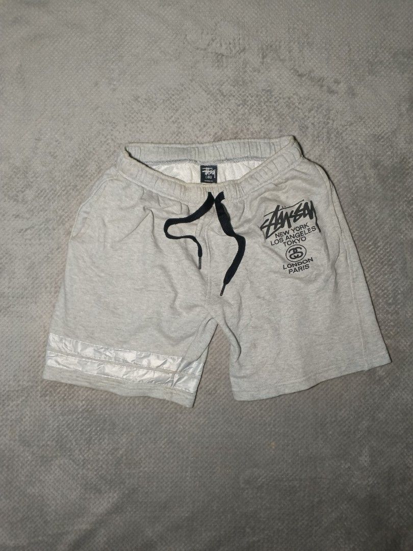 Stussy shorts (Category: Shorts) located in Cebu City. Submitted by authenticgrids (Listing ID 1470457449, Image 1). Description: Stüssy World Tour Sweat Shorts 🌎 Excllent Condition ✨ Issue/s: None Size on Tag L 🏷️ Best Fit: Medium Dimensions Width 14-16 stretchable inches Waistline actual measurements 28 can fit up to 32 📏 Length 17 inches 📥📥📥📥📥 DM us for more details.