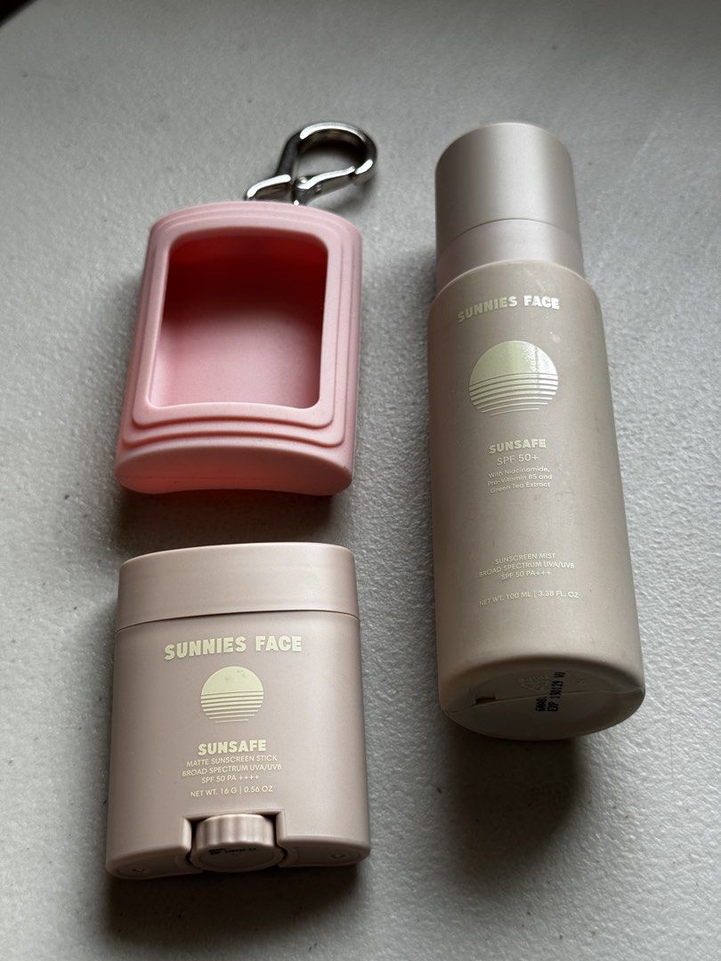 Sunnies Face Sunsafe Sunscreen Set (Category: Face Care) located in Las Pinas. Submitted by thestasher (Listing ID 1470353335, Image 1). Description: - Sunnies Face Sunsafe bundle for daily sun protection - Includes 16g matte sunscreen stick and 100ml sunscreen mist - Comes with a trendy pink silicone holder and carabiner keychain clip - Convenient travel set that easily clips onto bags or keys - Selling as a complete set only.