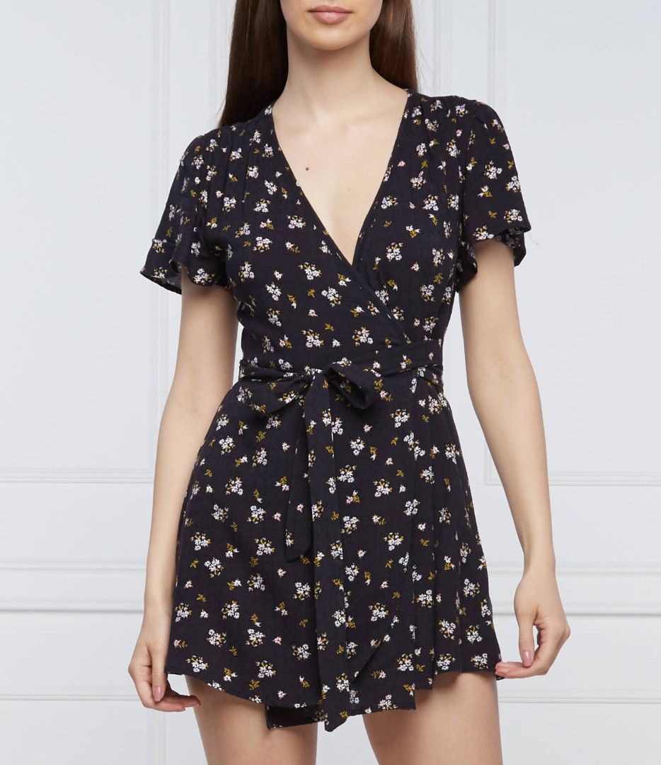 Superdry Floral Print Wrap Playsuit (Category: Rompers) located in Paranaque City. Submitted by calm_youngstore7 (Listing ID 1470442022, Image 3). Description: Navy blue wrap playsuit with white and yellow floral print all over. Short flutter sleeves, V-neckline, tie waist closure. Lightweight fabric, very comfortable and easy to wear. Stock and model reference photos included to show fit. Great piece for warm weather or casual outings. 15" pit t