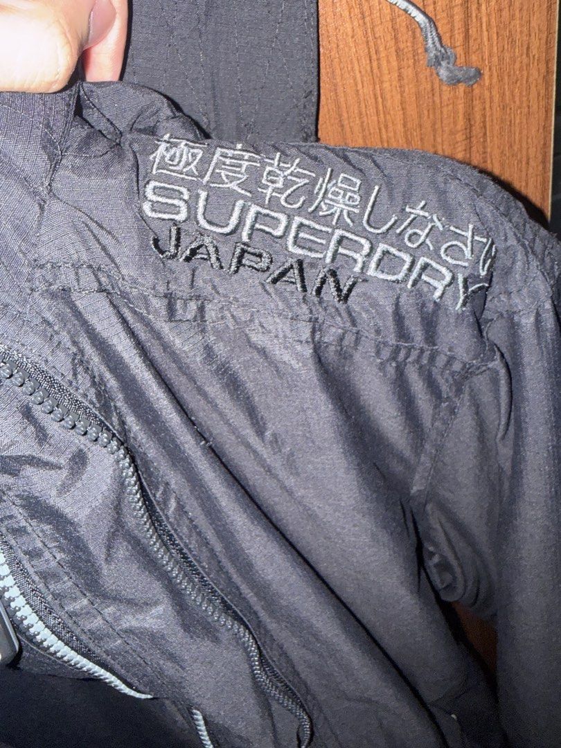 SUPERDRY Jacket for cold weather (Category: Coats, Jackets and Outerwear) located in Manila. Submitted by fastforest.ac2d10 (Listing ID 1470495264, Image 3). Description: Bought from Japan 2017 Original 3 Zipper Decent Condition White lettering on zipper has stain (seen in picture) .