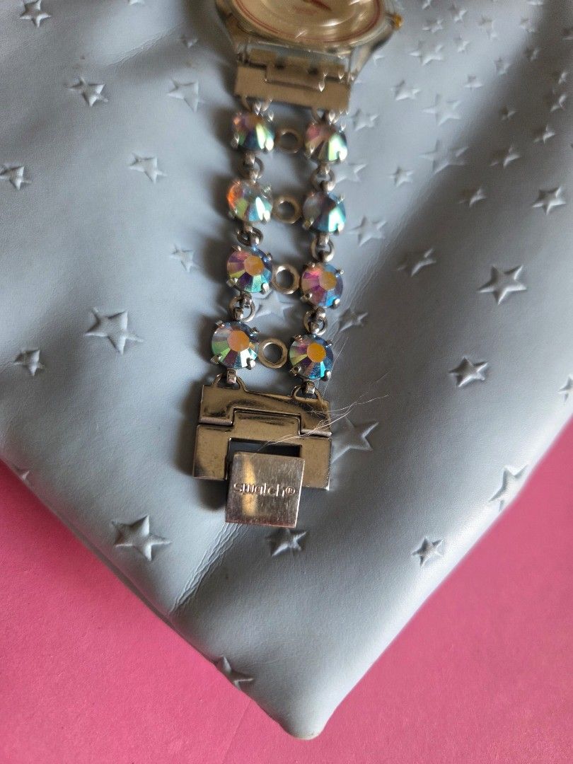 Swatch Rhinestone Bracelet Watch (Category: Women's Watches) located in Pasig City. Submitted by tatashki (Listing ID 1470375785, Image 3). Description: - Authentic 2002 Swatch Swiss quartz watch - Selling as is Crack on the face , bracelet no issues , can be used for other swatch - Silver-tone double chain bracelet embedded with sparkling iridescent rhinestones - Secure clasp closure stamped with the iconic Swatch logo - Transparent case back sh