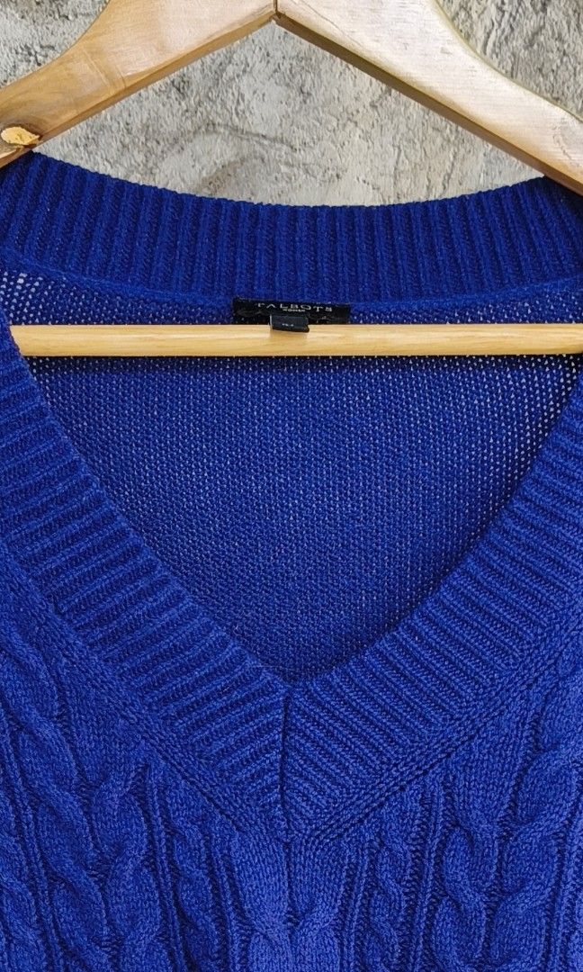 Talbots Blue V-Neck Cable Knit Sweater XL (Category: Coats, Jackets and Outerwear) located in Makati City. Submitted by theroadthrift (Listing ID 1470387652, Image 2). Description: - Brand: Talbots - Color: Bright blue - Size: XL (fits true to size) - Neckline: Classic V-neck with ribbed trim - Design: Detailed cable knit pattern on the front - Sleeves: Long sleeves with ribbed cuffs - Condition: Clean, excellent, and ready to wear.