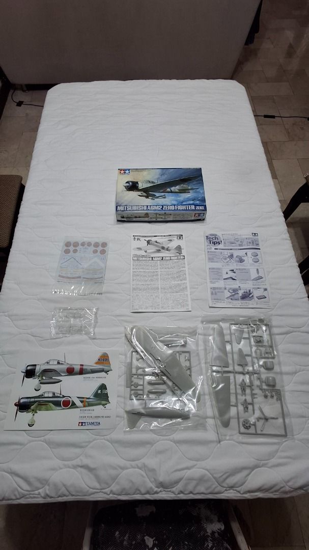Tamiya A6M2-Zero 1/48 Scale Model Airplane (Category: Gundam & Model Kits) located in Las Pinas. Submitted by emyemy5 (Listing ID 1470528569, Image 1). Description: - Item: Tamiya Mitsubishi A6M2 Zero plastic model kit - Condition: Unassembled, all parts 100% sealed in original plastic bags - Inclusions: Complete instruction manual, tech tips sheet, and decals - Box Condition: Shows minor wear along the edges, but contents are pristine - Perfect 
