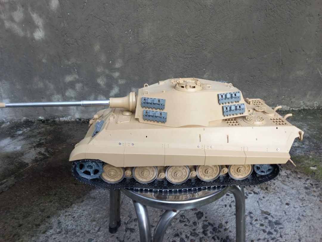 Tamiya German Tiger II King Tiger Tank Model (Category: Remote Control Toys) located in Valenzuela. Submitted by swiftforest.985ae2 (Listing ID 1470486830, Image 1). Description: - Large-scale German Tiger II King Tiger tank model - Detailed turret with side-mounted spare track links - Features a realistic long metal barrel - Classic tan paint finish with fitted black tracks - Perfect for military model enthusiasts and collectors.