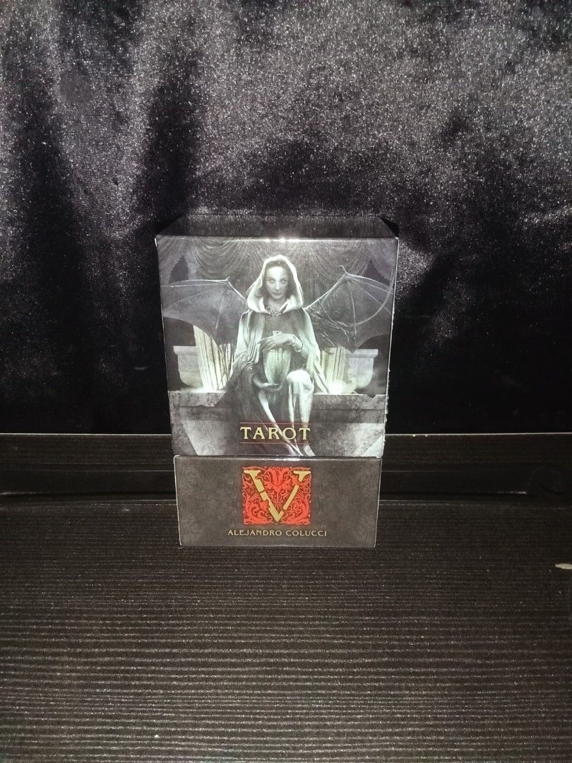 Tarot V (Vampire) Deck (AUTHENTIC) (Category: Everything Else Others) located in Iloilo. Submitted by yana.06 (Listing ID 1470368245, Image 2). Description: Complete Tarot card deck by Alejandro Colucci featuring dark, gothic artwork and a striking winged creature on the box. Perfect for collectors and divination lovers alike..