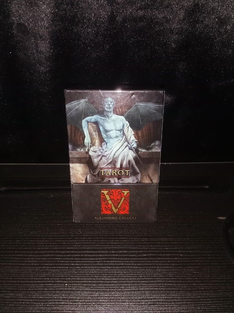 Tarot V (Vampire) Deck (AUTHENTIC) (Category: Everything Else Others) located in Iloilo. Submitted by yana.06 (Listing ID 1470368245, Image 1). Description: Complete Tarot card deck by Alejandro Colucci featuring dark, gothic artwork and a striking winged creature on the box. Perfect for collectors and divination lovers alike..
