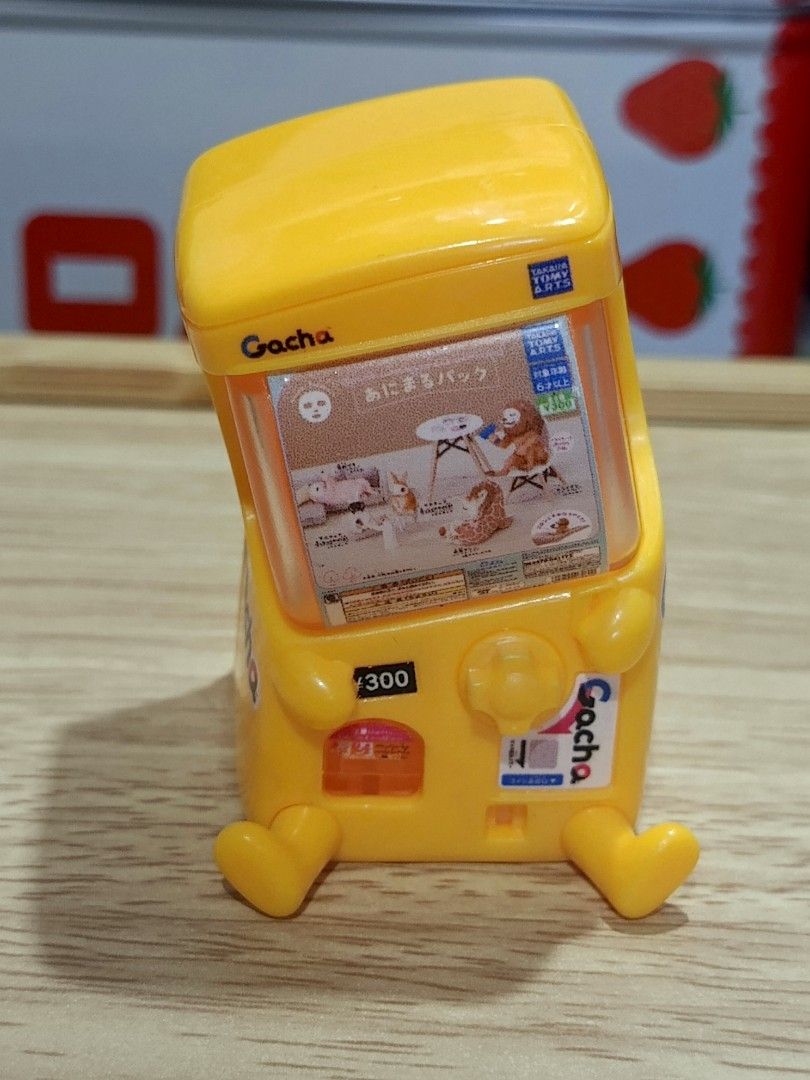 T-Arts Gacha Machine Mini Figure Yellow (Category: Designer & Blind Box Toys) located in Paranaque City. Submitted by niropa (Listing ID 1470391142, Image 1). Description: - Authentic Takara Tomy Arts gacha machine miniature figure - Eye-catching yellow color with cute outstretched arms and legs - Detailed design featuring a tiny animal graphic and 300 yen coin slot - Stands firmly on its own for easy display - A must-have collectible for gashapo