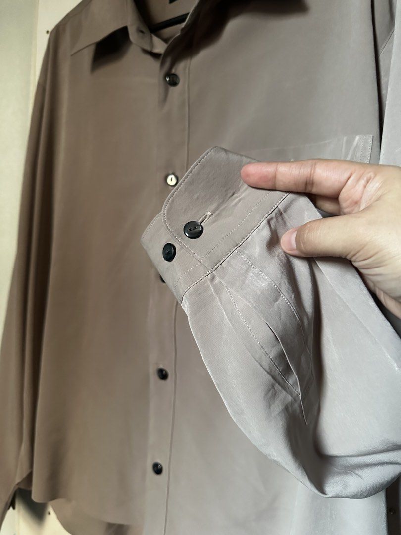 Taupe button down longsleeves (Category: Longsleeves) located in Cavite. Submitted by chicfinds.slay (Listing ID 1470453388, Image 3). Description: ✨soft texture very elegant/velvet ✨perfect fit corporate /office/casual ✨best fit s-semi large ✨need quick iron lang ✨no flaws.