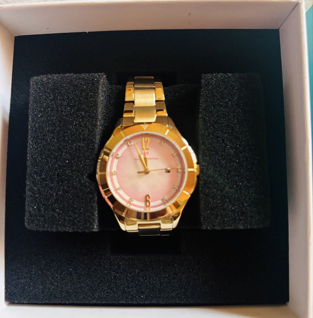 TechnoMarine Gold Watch with Pink Dial (Category: Women's Watches) located in San Pedro. Submitted by maricordmd (Listing ID 1470539764, Image 2). Description: - Brand: TechnoMarine - Finish: Elegant gold-tone - Dial: Pink gradient with sparkling crystal hour markers - Feature: Convenient date window - Strap: Matching gold metal link bracelet - Inclusion: Original turquoise and white presentation box - Condition: Excellent, ready to wear.