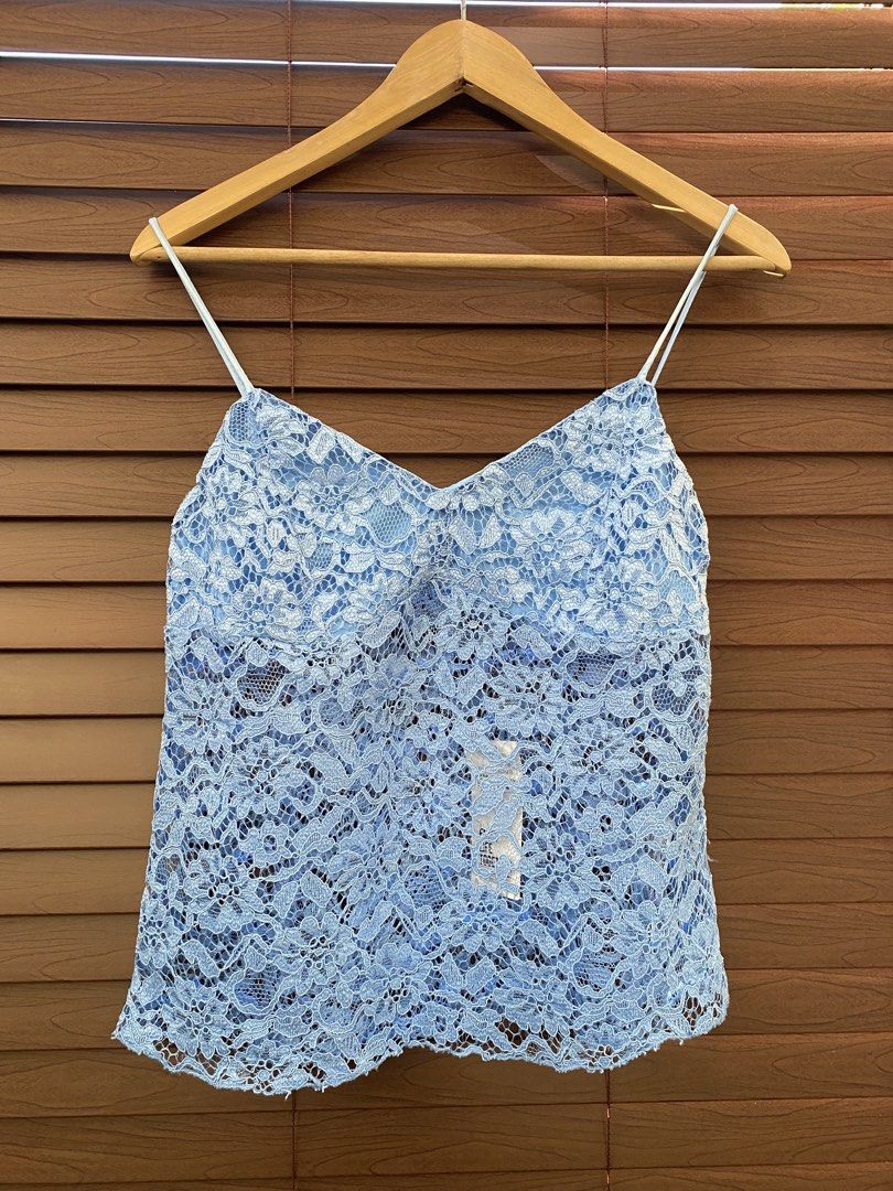 Terranova Blue Lace Cami Top (Category: Sleeveless) located in Dasmarinas. Submitted by closetcleanser_ (Listing ID 1470430578, Image 1). Description: - Brand: Terranova - Size: Medium - Color: Light blue - Design: V-neckline, spaghetti straps, side zipper closure - Details: Fully lined with a delicate floral lace overlay - Condition: Brand new with original store tags attached.
