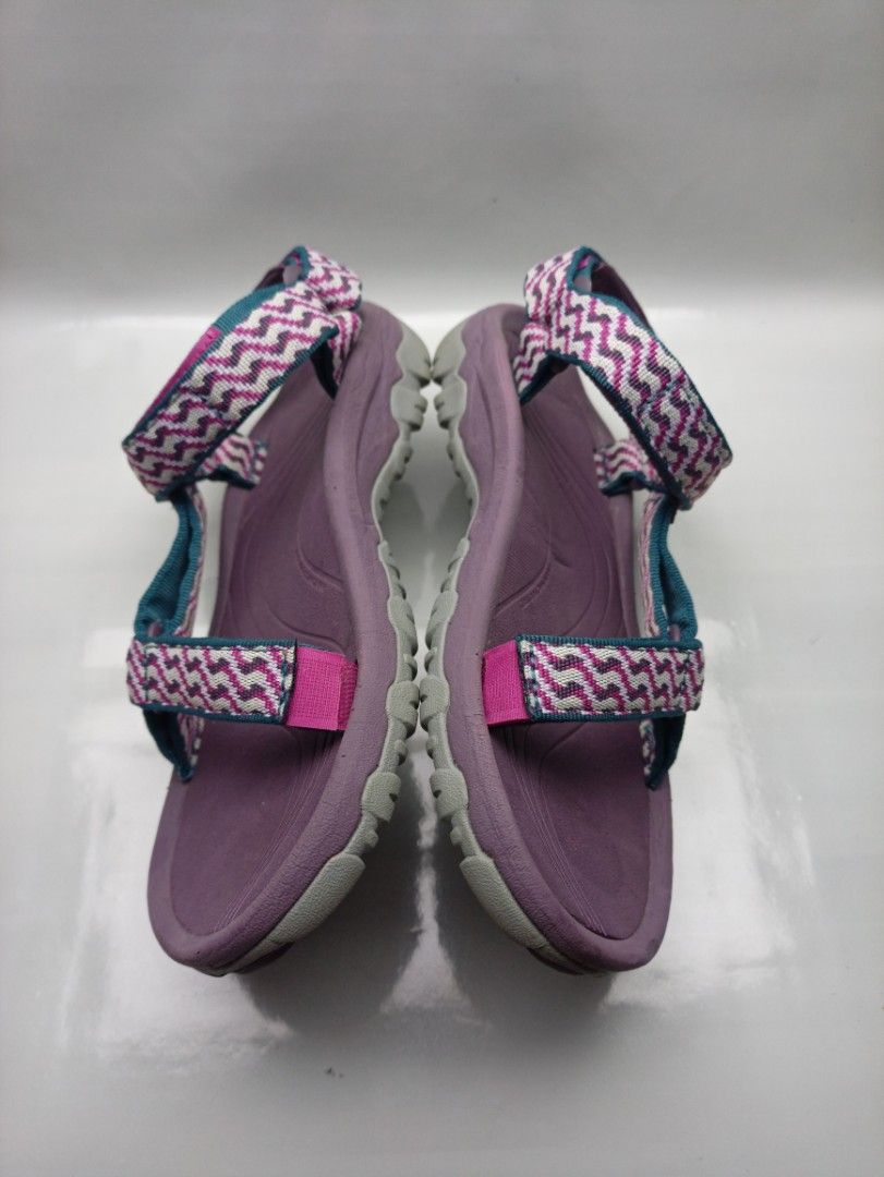 Teva Hurricane Sandals Purple Size 7 US (Category: Sandals) located in Dasmarinas. Submitted by ziapatos (Listing ID 1470487777, Image 3). Description: Teva Hurricane sandals in purple. Zigzag pattern straps in pink, grey, and teal. Adjustable hook and loop closures at ankle and forefoot. Durable rubber outsole with good grip. Size 7 US women, 5 UK, 38 EU, 24 cm. Great outdoor walking sandals for hiking or beach trips. VERYGOOD CONDITION Php 850 