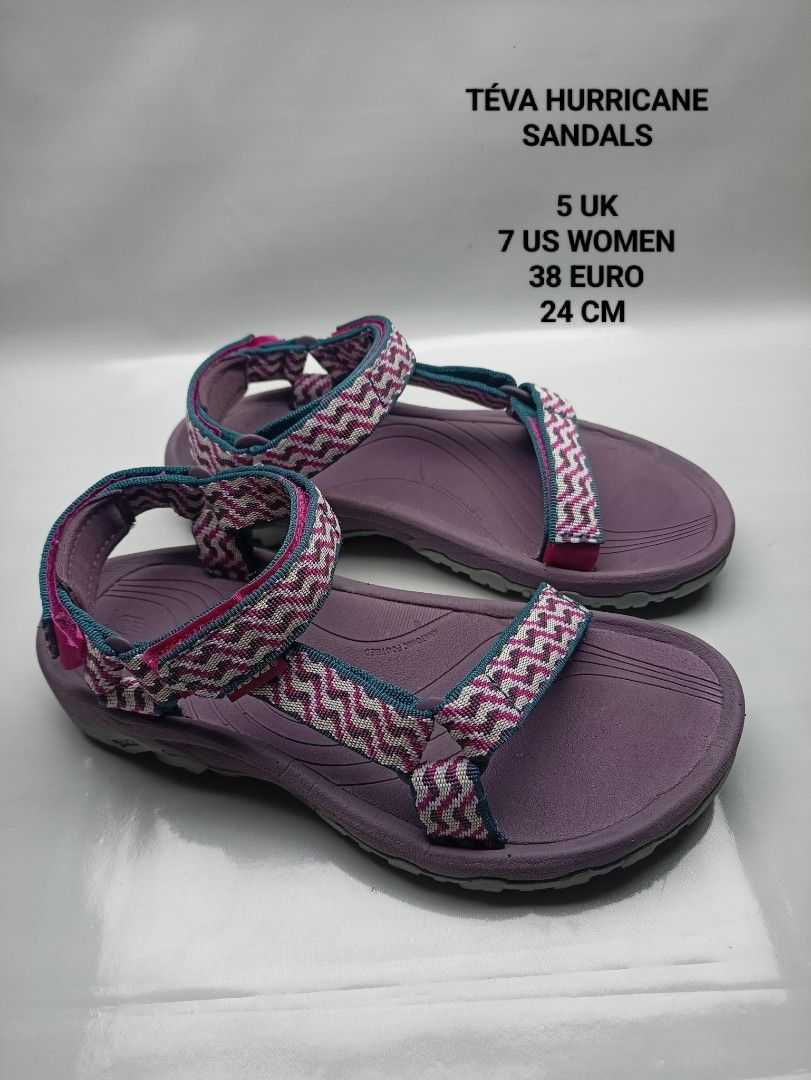 Teva Hurricane Sandals Purple Size 7 US (Category: Sandals) located in Dasmarinas. Submitted by ziapatos (Listing ID 1470487777, Image 1). Description: Teva Hurricane sandals in purple. Zigzag pattern straps in pink, grey, and teal. Adjustable hook and loop closures at ankle and forefoot. Durable rubber outsole with good grip. Size 7 US women, 5 UK, 38 EU, 24 cm. Great outdoor walking sandals for hiking or beach trips. VERYGOOD CONDITION Php 850 