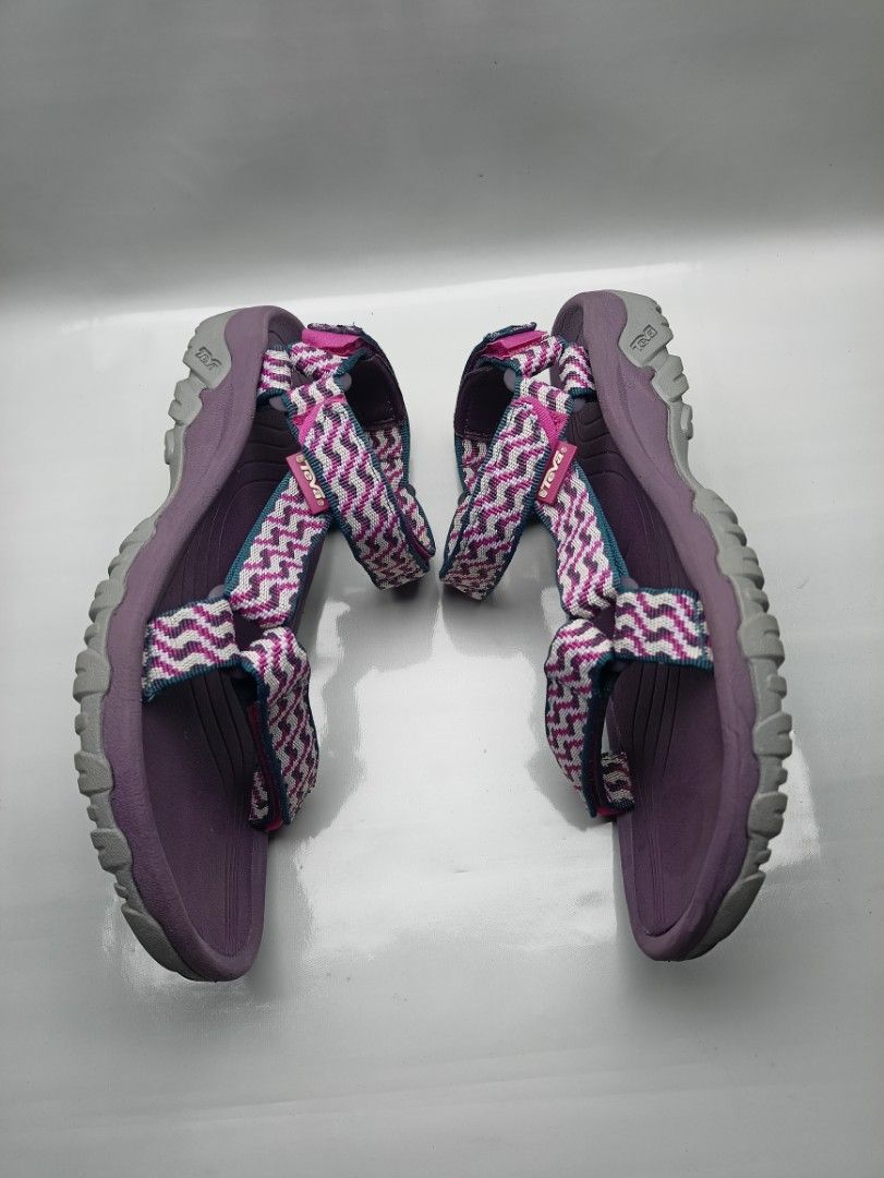 Teva Hurricane Sandals Purple Size 7 US (Category: Sandals) located in Dasmarinas. Submitted by ziapatos (Listing ID 1470487777, Image 2). Description: Teva Hurricane sandals in purple. Zigzag pattern straps in pink, grey, and teal. Adjustable hook and loop closures at ankle and forefoot. Durable rubber outsole with good grip. Size 7 US women, 5 UK, 38 EU, 24 cm. Great outdoor walking sandals for hiking or beach trips. VERYGOOD CONDITION Php 850 