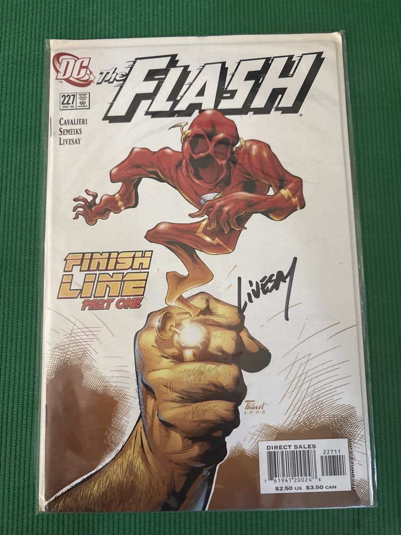 The Flash #227 Signed Comic Book (Category: Comics & Manga) located in Makati City. Submitted by goodfindsonly (Listing ID 1470353695, Image 1). Description: - Title: DC The Flash Issue #227 (Finish Line Part One) - Release Date: December 2005 - Signature: Signed by Livesay on the cover - Authenticity: Includes Saturday Morning Comics Certificate of Authenticity on the back - Condition/Storage: Stored securely in a protective plastic bag and back