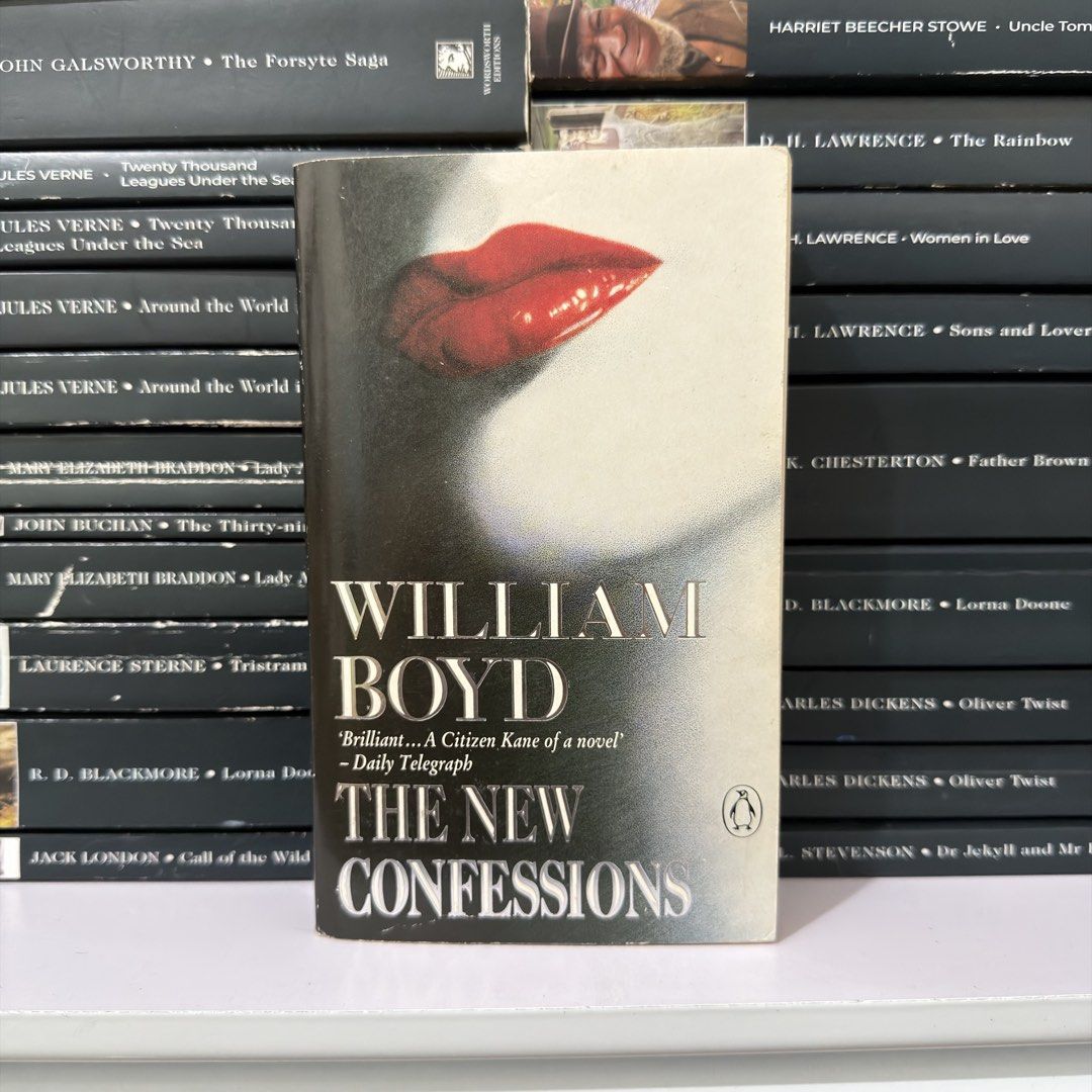 The New Confessions by William Boyd Penguin Paperback (Category: Storybooks) located in Lingayen. Submitted by readwjane (Listing ID 1470479999, Image 1). Description: - Title & Author: The New Confessions by William Boyd - Publisher: Penguin - Format: Paperback - Cover Design: Striking red lips graphic - Condition: Clean inside pages, light shelf wear on edges - Genre: Classic Fiction.