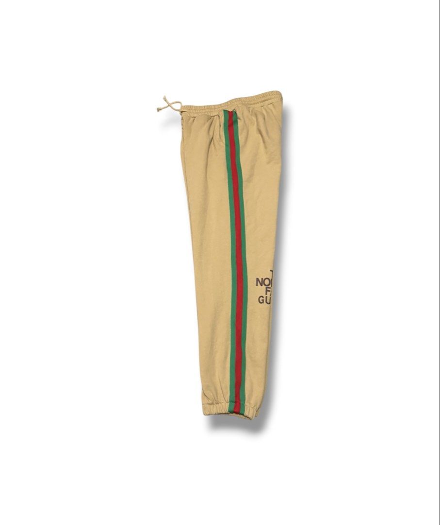 The North Face x Gucci Jogging Pants (Category: Luxury Apparel) located in Bulacan. Submitted by sanjisthrift (Listing ID 1470537039, Image 2). Description: Width 28-32 Length 36 Excellent Condition 9.5/10.