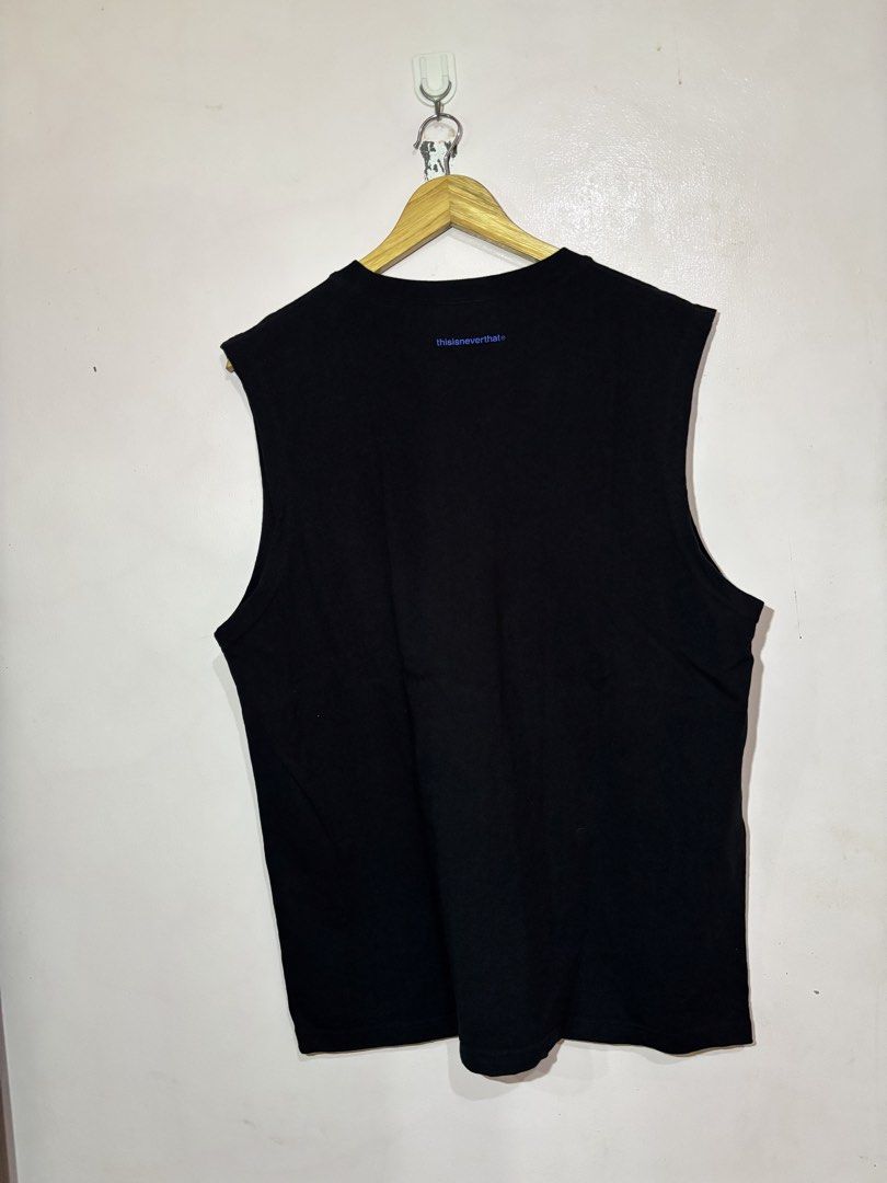 thisisneverthat Black Tank Top Size S (Category: Activewear) located in Kalibo. Submitted by mack29 (Listing ID 1470351881, Image 2). Description: - Brand: thisisneverthat - Item: Black tank top - Size: S (tag attached at inner collar) - Material: Comfortable cotton, standard fit - Design: Blue text logo on chest and upper back - Cut: Sleeveless with classic crew neck - Condition: Brand new with tags.