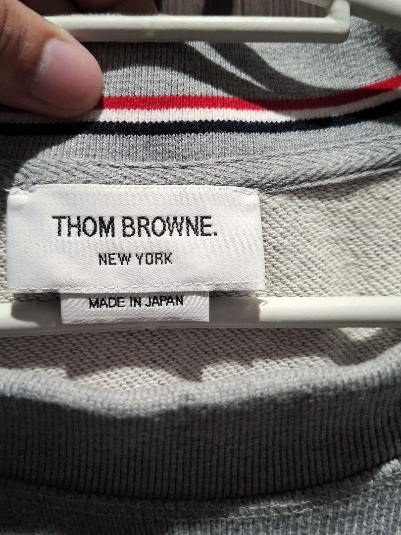 Thom Browne Grey 4-Bar Oversized Classic Sweatshirt (Guaranteed Authentic) (Category: Coats, Jackets and Outerwear) located in Pasig City. Submitted by coveted.mnl (Listing ID 1470469130, Image 2). Description: Guaranteed Authentic📌 In Pristine Condition🤍 W/ extra button~ Best fit to: Xl Width : 25 Length : 28 (MEASURED BY INCHES) 9.5/10 overall condition No issues or flaws in fabric Retailed for $750 (P47,250) • P 9,000 Slightly negotiable • P