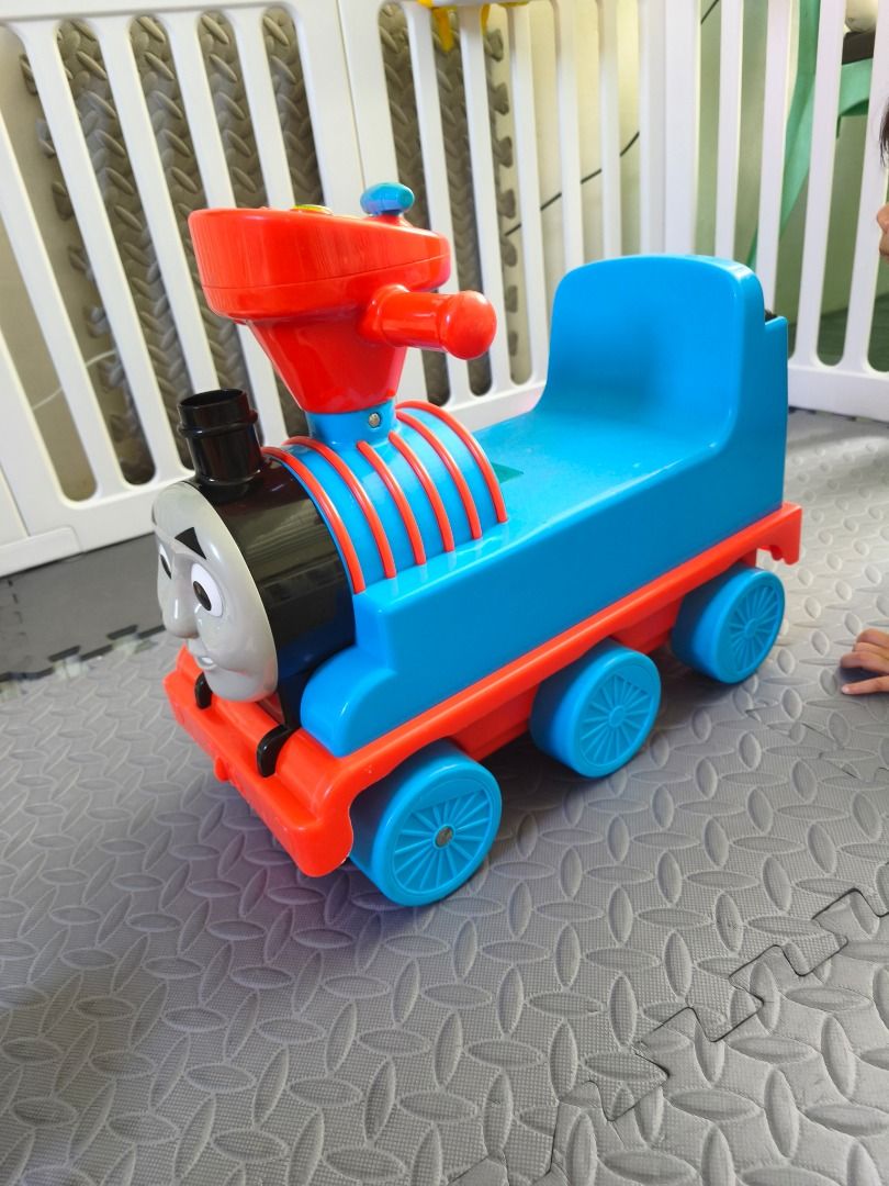 Thomas and Friends Ride-On Train Toy (Category: Kids Toys) located in Caloocan City. Submitted by lato042125 (Listing ID 1470402173, Image 3). Description: - Iconic Thomas the Train design with a friendly smiling face in bright blue and red - Easy-grip red steering handlebar for safe and simple control - Comfortable blue molded seat designed for toddlers - Sturdy plastic construction built to last - Smooth-rolling wheels ideal for both indoor and