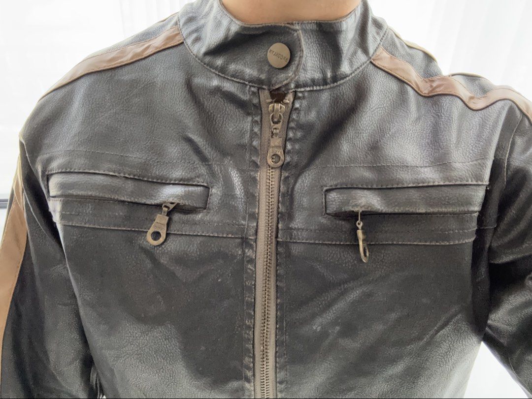 thrifted black & brown leather racer jacket (Category: Coats, Jackets and Outerwear) located in Manila. Submitted by gothclaudia (Listing ID 1470390011, Image 3). Description: RFS: decluttering my closet! :) not my style anymore - originally thrifted from Singapore last May 2025, hasn't been worn since! - heavy duty leather jacket - dark brown or black with beige and tan contrast racing stripes - front zip closure, two zipped chest pockets, and s