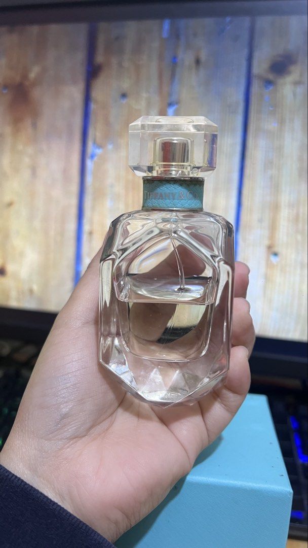 Tiffany & Co. Eau de Parfum 50ml (Category: Fragrance & Deodorants) located in Caloocan City. Submitted by yhanggirl (Listing ID 1470467375, Image 3). Description: - Authentic Tiffany & Co. Signature Eau de Parfum - Size: 50ml bottle (approx. 50% remaining) - Stunning diamond-faceted glass bottle with iconic Tiffany blue collar - Includes original classic robin egg blue retail box - Guaranteed authentic, well-stored from a trusted Carousell selle