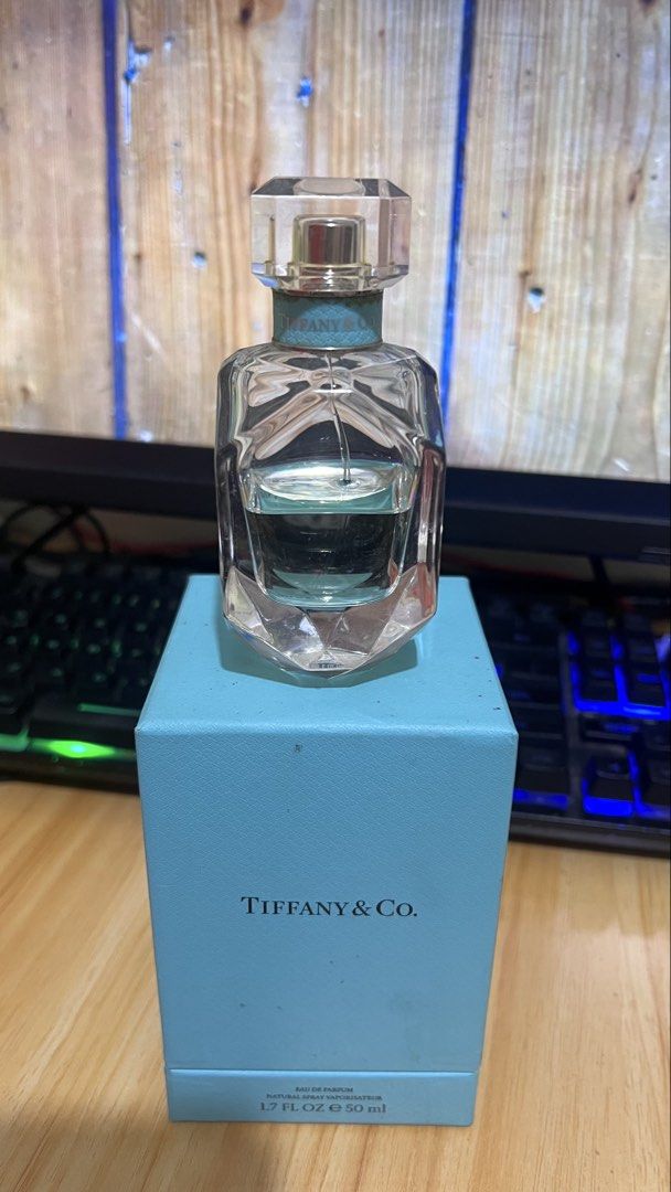 Tiffany & Co. Eau de Parfum 50ml (Category: Fragrance & Deodorants) located in Caloocan City. Submitted by yhanggirl (Listing ID 1470467375, Image 2). Description: - Authentic Tiffany & Co. Signature Eau de Parfum - Size: 50ml bottle (approx. 50% remaining) - Stunning diamond-faceted glass bottle with iconic Tiffany blue collar - Includes original classic robin egg blue retail box - Guaranteed authentic, well-stored from a trusted Carousell selle