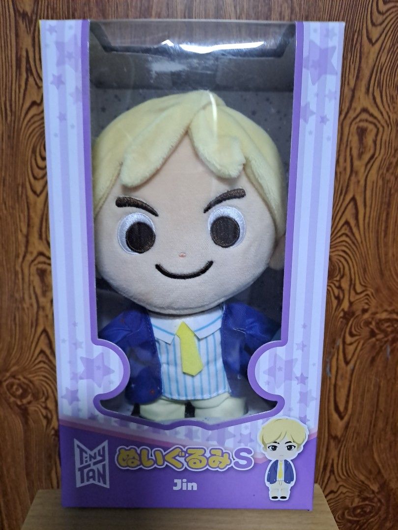 TinyTAN Jin Plush Doll Figure (Category: Plushies & Soft Toys) located in Manila. Submitted by yatzyubz (Listing ID 1470390090, Image 1). Description: - Official BTS TinyTAN Jin plush doll - Iconic blonde hair and blue-striped vest with yellow tie - Brand new, unopened in original purple packaging - Perfect collectible item for ARMY fans - de clutter.. meet-up only.