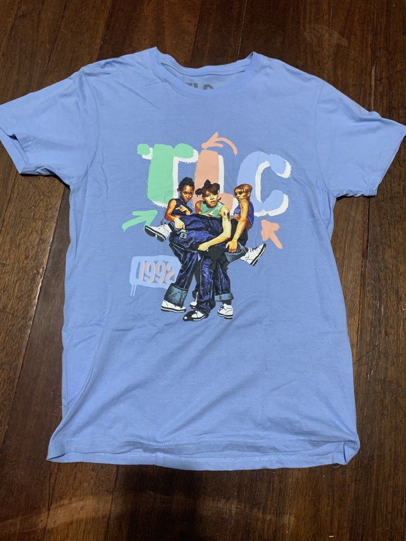 TLC 1992 Graphic Tee Light Blue Size L (Category: Tshirts & Polo Shirts ) located in Malabon City. Submitted by solerevolutionph (Listing ID 1470548751, Image 1). Description: - Design: TLC 1992 group member graphic tee - Color: Light blue - Size: L (Pit to pit: 18 inches, Length: 28 inches) - Material: 100% cotton - Origin: Made in Bangladesh - Style: Vintage band merch 18.5 x 28 9/10 DM me for sure buyer. ✅GCash/Maya/BDO/GoTyme for payment. ✅Sh