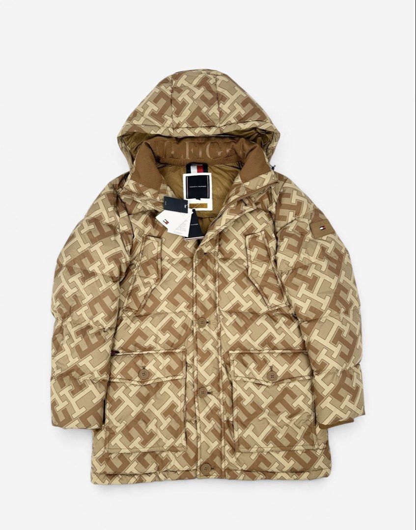 Tommy Hilfiger (Category: Coats, Jackets and Outerwear) located in Manila. Submitted by draftdrops (Listing ID 1470438353, Image 1). Description: Puffer jacket,zip and button,Rubber logo on sleeve , all over design , brand new with tag and like new condition Width :25 Length :35 Size:xl .